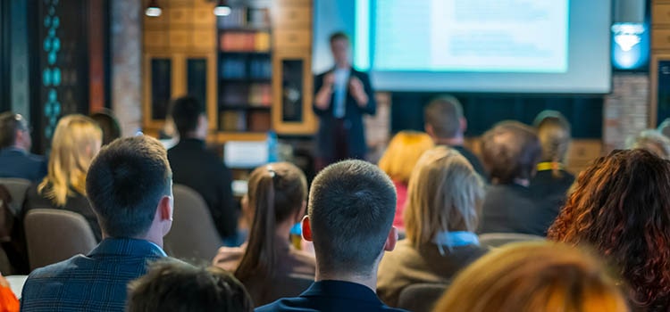 audience listens to lecturer at workshop