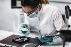 scientist in lab inspects evidence