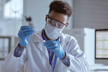 forensic scientist working in laboratory
