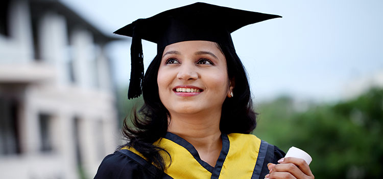 woman college graduate holding bachelors diploma