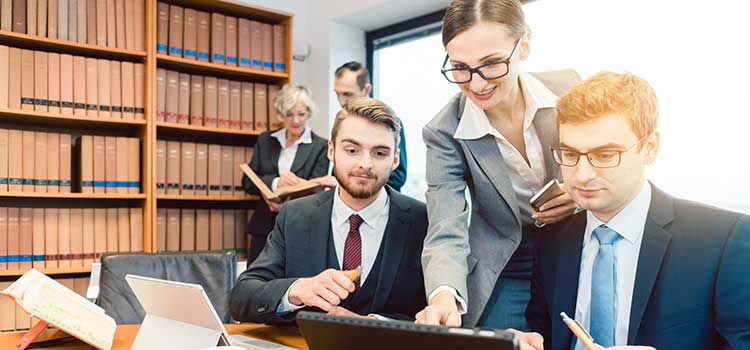 paralegal works with lawyers in busy law office