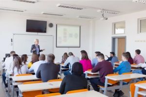 criminal justice professor gives a lecture to a college classroom